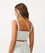Blusa musculosa cropped de algodón con tirantes elásticos, busto torcido, espalda de lastex e hilo teñido con rayas a contraste.