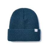Gorro de lana tejido a punto, color azul petróleo, con etiqueta de la marca Katin cosida en el borde.