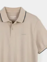 Remera tipo polo negra de algodón, con cuello y borde de mangas con línea blanca.