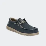 Zapatos Hey Dude modelo Wally Braided, confeccionados en tejido textil color marrón con cordones elásticos beige, costuras visibles en el empeine y suela ligera de goma.