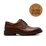Zapato casual de cuero negro con cordones, diseño de corte bajo y suela de goma con relieve.