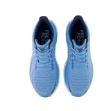 Championes de running New Balance Fresh Foam X 1080v12, color celeste con detalles en azul y blanco.