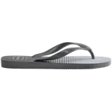 Sandalias tipo ojotas Havaianas con estampado de hojas tropicales en tonos verdes sobre base azul marino. Presentan tiras de goma azul marino con el logo de la marca en relieve.