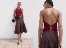 Top de punto fino con cuello halter y espalda descubierta con detalle de aro metálico. Diseño entallado sin mangas.