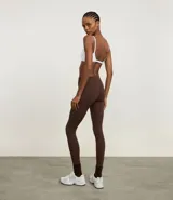 Calza legging deportiva de poliamida color azul con cintura alta de 10 cm.