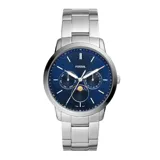 Reloj analógico Fossil Neutra con caja de acero inoxidable de 44 mm, esfera azul con subesferas multifunción y fase lunar, y pulsera de eslabones de acero plateado.