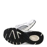 Championes Puma Milenio Tech Lt estilo retro inspirados en los años 2000, de color plateado y blanco con detalles en negro, confeccionados en malla y material sintético, con suela chunky y cordones.
