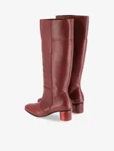 Bota Sontag alta de cuero vacuno negro con tacón de madera y suela de cuero.
