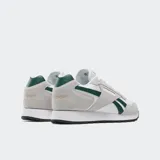 Championes Reebok Glide Skor blancos con detalles en gris y verde.