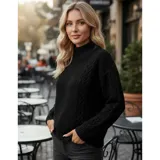 Sweater de punto color marrón con diseño de trenzas y textura en relieve. Presenta cuello alto, mangas largas y puños acanalados.