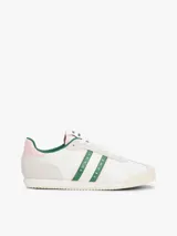 Zapatillas deportivas Tommy Jeans de estilo retro, color blanco con detalles en verde y rosa. Confeccionadas en poliéster con paneles de texturas mixtas, logo de la marca en el lateral y suela de goma.