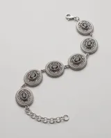 Pulsera de plata 925 con dijes circulares de diseño texturizado y piedras naturales de topacio místico.