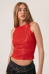 Musculosa de fiesta con lentejuelas en la parte frontal y tejido de morley en la parte trasera.