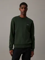 Buzo verde oscuro de algodón y poliéster con cuello redondo, puños y bajo acanalados. Presenta el logo de Calvin Klein bordado en pequeño en el pecho.