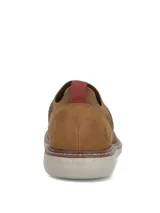 Zapatos slip on color marrón de tejido textil con refuerzo de cuero en el talón y suela gris clara.