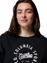 Buzo de cuello redondo Columbia, color negro, con estampado circular en el pecho que incluye el logo y nombre de la marca. Presenta puños y dobladillo acanalados.