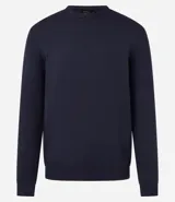 Suéter de punto color borgoña, con cuello redondo, sisas ligeramente desplazadas y bajo y puños acanalados.