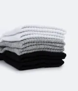 Kit de tres pares de medias deportivas negras de caña corta con suela de rizo.