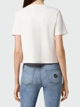Camiseta corta blanca de algodón con logo "Plein" dorado estampado en el frente.