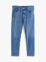 Jean azul de corte amplio con pierna cónica, confeccionado en tejido denim elástico de algodón.