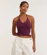 Top corto (cropped) de algodón con escote en V y tiras que se atan en la nuca (frente única).