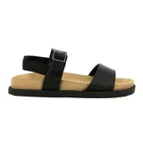 Sandalias bajas color marrón claro con tira ancha sobre los dedos y pulsera con hebilla dorada al tobillo.