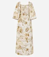 Vestido midi evasê de viscolino con estampa de mapa, escote cuadrado, mangas amplias con lunares, lastex en la espalda y recorte fruncido en la cintura.