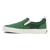 Zapatillas tipo slip-on Quiksilver modelo Shore, color verde con suela blanca de goma y elásticos laterales blancos. Presenta el logo de la marca estampado en negro en la parte superior.