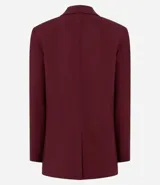 Blazer celeste de viscosa y lino, con cuello inglés, cierre de un botón y solapas.