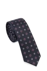 Corbatín azul marino con estampado de flores geométricas en rosa y blanco.