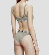 Bombacha de algodón elástico con efecto desgastado tipo denim, tiro medio y elástico en la cintura con logo Diesel aplicado.