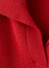 Jersey de punto de canalé color rojo, con cuello polo y manga larga, de corte relajado.