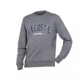 Buzo Lacoste de cuello redondo y manga larga, confeccionado en tejido French Terry color gris melange. Presenta estampado frontal con el nombre de la marca en tipografía universitaria y puños y ruedo acanalados.