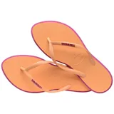 Ojotas Havaianas modelo Slim Point, con base color violeta claro y borde lateral en tono rojizo. Presentan tiras finas con textura y logo de la marca en relieve.