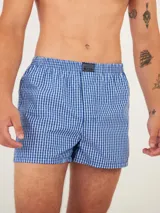 Bóxer Kevingston de algodón blanco con estampado integral de labios rojos. Cuenta con cintura elastizada y etiqueta de la marca en el frente.