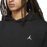 Canguro Jordan Essentials con capucha, confeccionado en tejido fleece de color negro. Presenta un diseño minimalista con el logo Jumpman bordado en blanco en el pecho y bolsillo frontal tipo canguro.
