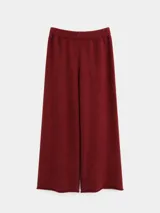 Pantalón tejido de corte amplio y relajado, con cintura elástica y terminaciones al corte en el ruedo.