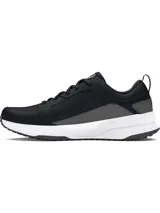 Championes Under Armour Charged Edge, color negro con detalles en gris y entresuela blanca. Cuentan con capellada de malla transpirable con superposiciones de cuero y material sintético, tecnología Charged Cushioning® en la entresuela y suela de goma resistente.