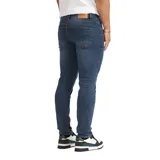 Pantalón de denim Quiksilver modelo Rin, corte ajustado, color azul oscuro con sutil efecto desgastado.