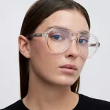 Lentes blueblocker con armazón de estilo aviador en color transparente. Cuentan con protección contra luz azul y rayos UV400, fabricados en material bio-based.