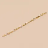 Pulsera de eslabones ovalados alternados en oro blanco y oro amarillo de 9k.