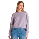 Buzo lila de mujer, marca Caterpillar, confeccionado en tejido de rizo francés (70% algodón, 30% poliéster). Tiene cuello redondo, puños y cintura de punto elástico. Presenta un bordado de una oruga en el pecho y un parche bordado con el logo de Cat en la parte inferior de la manga.