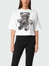 Camiseta corta blanca de algodón con cuello redondo y mangas cortas. Presenta un estampado frontal de un oso de peluche con strass y el logo de la marca Philipp Plein.