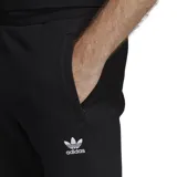 Pantalón de jogging negro Adidas con logo blanco bordado en el muslo izquierdo.