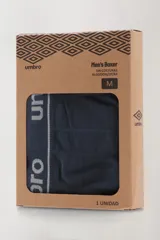 Boxer azul marino sin costuras de algodón, con cintura elástica gris con el logo de la marca.