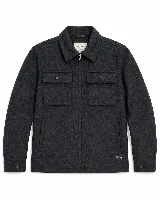 Chaqueta de paño Brooksfield con cierre frontal, cuello clásico, dos bolsillos frontales con solapa y botones, y puños ajustables con botón.