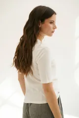 Remera manga 3/4 color celeste.