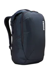 Mochila Thule Subterra de 34 litros, color azul oscuro, con organizador de viaje extraíble, funda acolchada para laptop de 15" y múltiples bolsillos para dispositivos electrónicos.