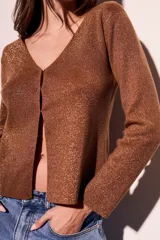 Cárdigan negro de lurex con escote en V y mangas largas.