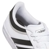 Championes Adidas modelo Hoops 4.0, de diseño urbano inspirado en el básquetbol. Presentan un empeine de cuero sintético blanco con las icónicas tres tiras laterales en color negro y detalles en gris en el talón. Cuentan con suela de goma tipo cupsole para mayor estabilidad y durabilidad.